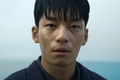Hwang Jun ho looking at someone in Squid Game