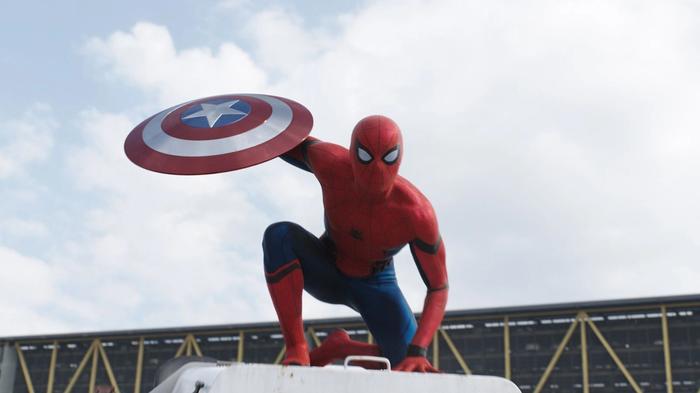 Tom Hollands Spider-man in civil war holding captain america's shield
