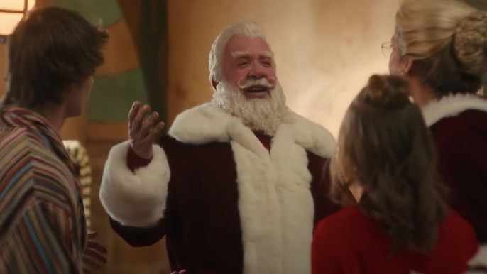 Tim Allen as Scott Calvin/Santa Clause talking to elves in The Santa Clauses