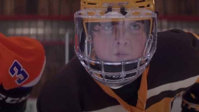 The mighty ducks: game changers season 1 Brady Noon as Evan Morrow playing ice hockey