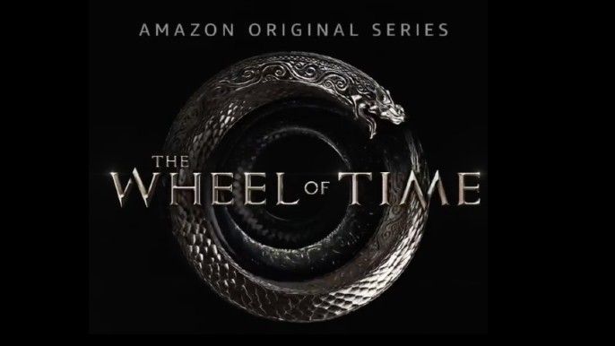 the wheel of time logo in dark background
