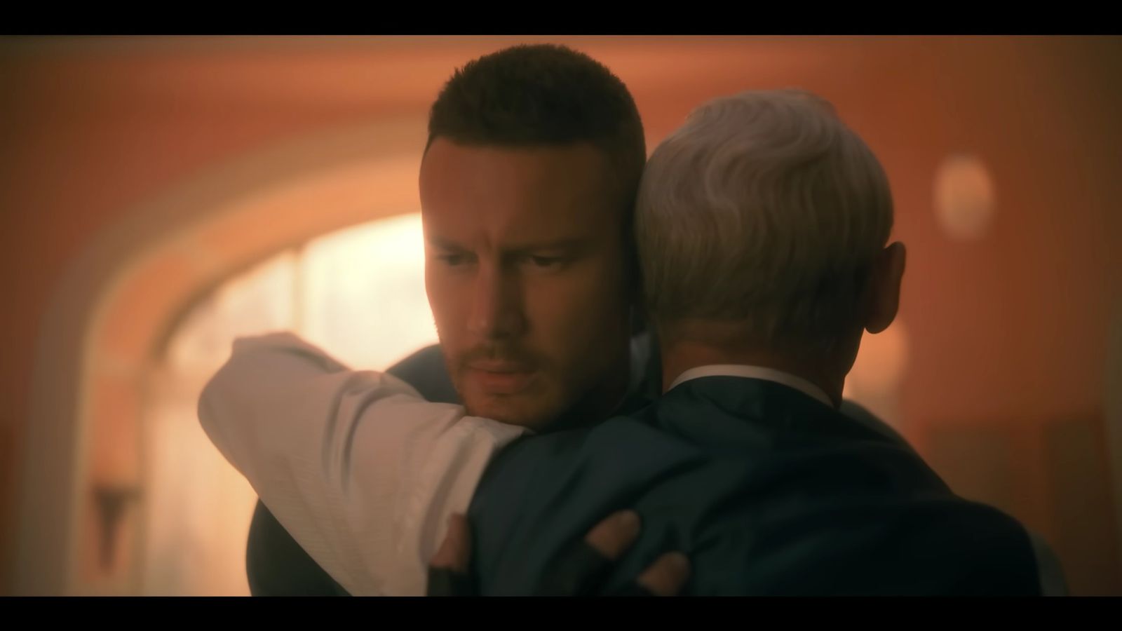 Luther (played by Tom Hopper) hugging Reginald (played by Colm Feore) in The Umbrella Academy Season 3.
