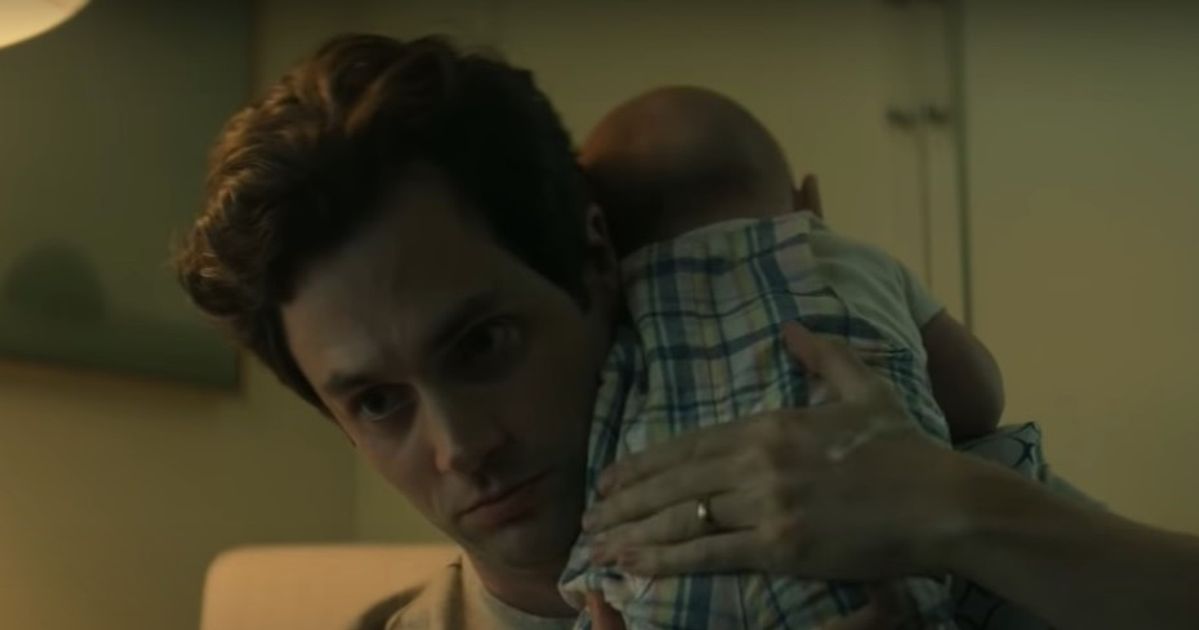 Joe holding his baby Henry