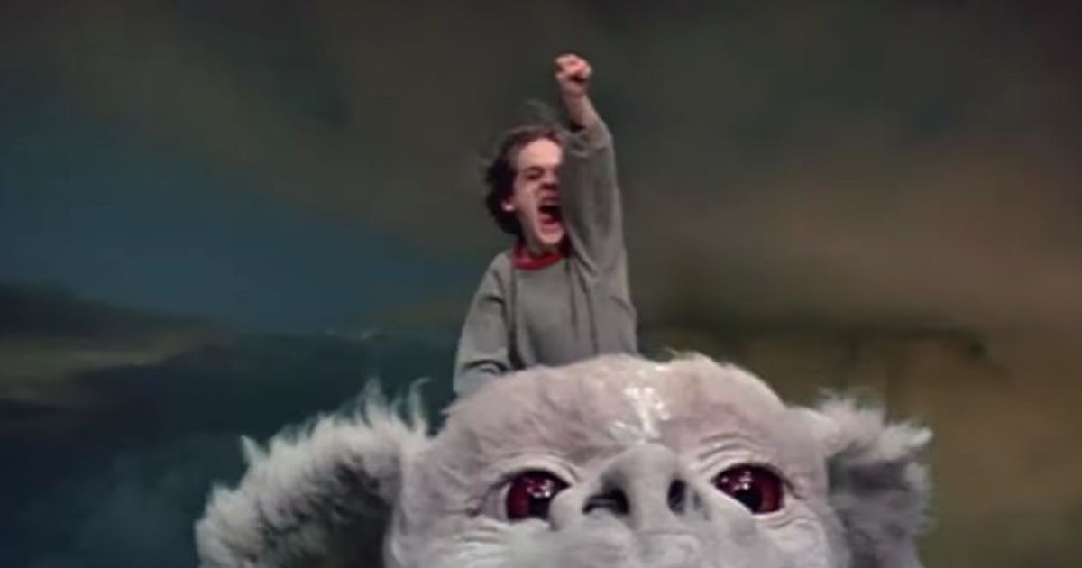 Barret Oliver as Bastian Bux riding Falkor in The NeverEnding Story