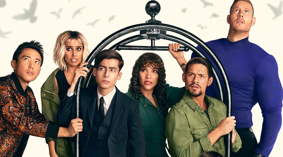 The Umbrella Academy poster character standing on hotel luggage trolley