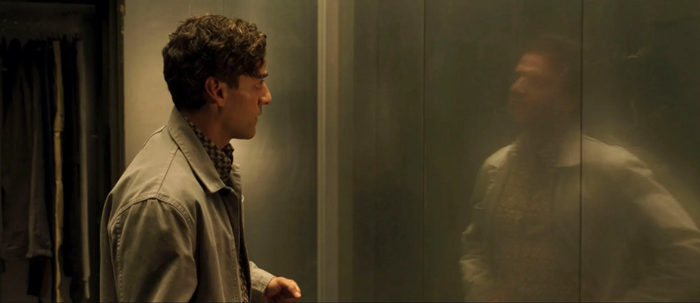 Marc Spector, the primary personality, is shown talking to his alternate personalities as his reflection. 