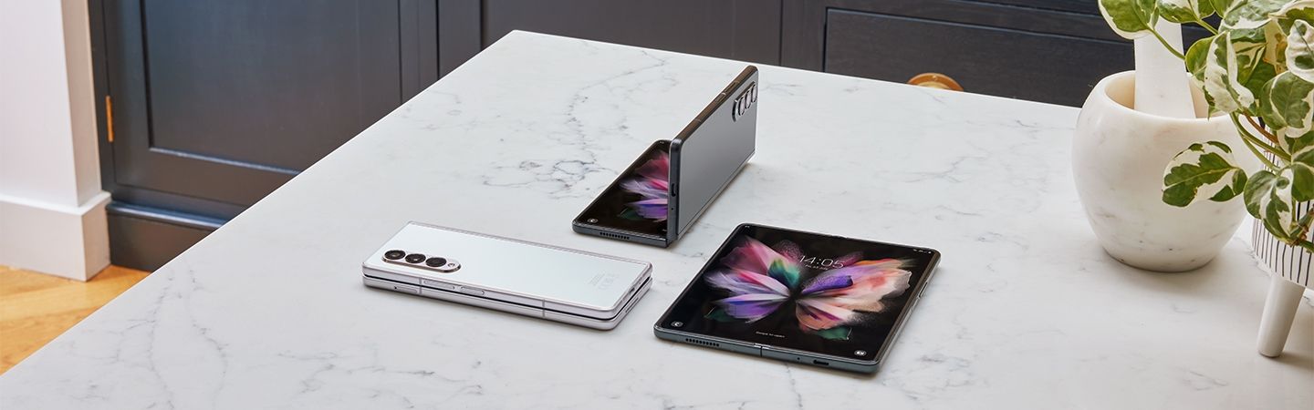 Samsung Galaxy Z Fold3 on a marble worktop in a variety of positions