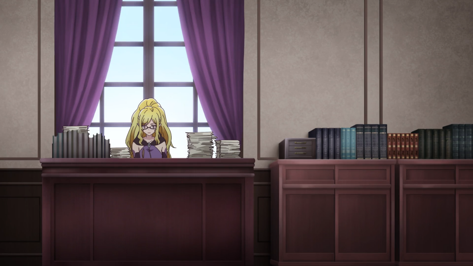 Shutina at her desk in I'm Quitting Heroing Episode 3
