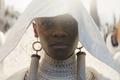 Letitia Wright as Shuri wearing white veil for Black Panther: Wakanda Forever