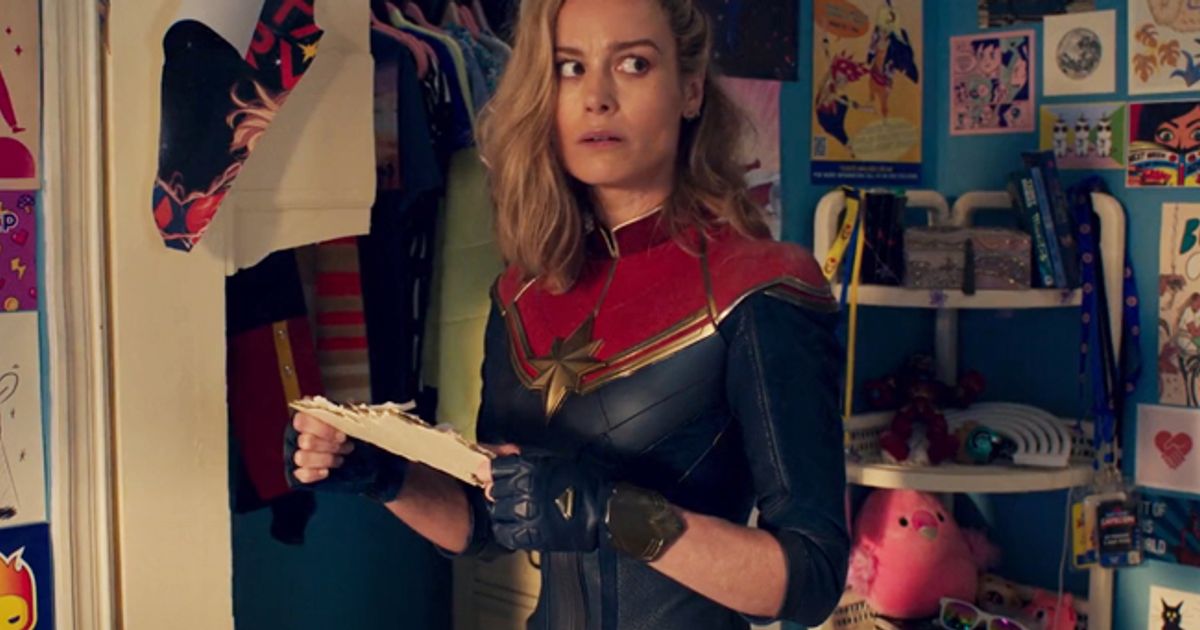 Captain Marvel emerging from Kamala Khan's room