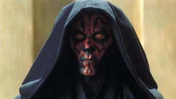 darth maul from star wars is wearing a black robe with a hood .