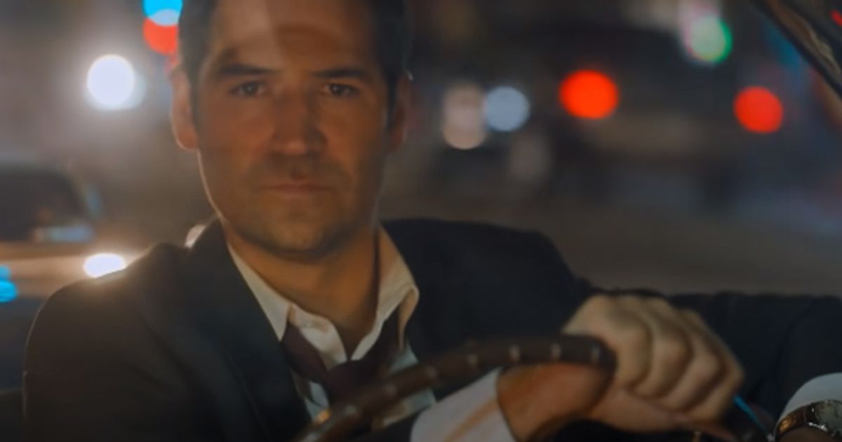 The Lincoln Lawyer Season 1 Manuel Garcia-Rulfo as Mickey Haller behind the wheels of a car