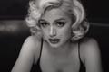 Blonde Ana de Armas as Marilyn Monroe looking at a mirror