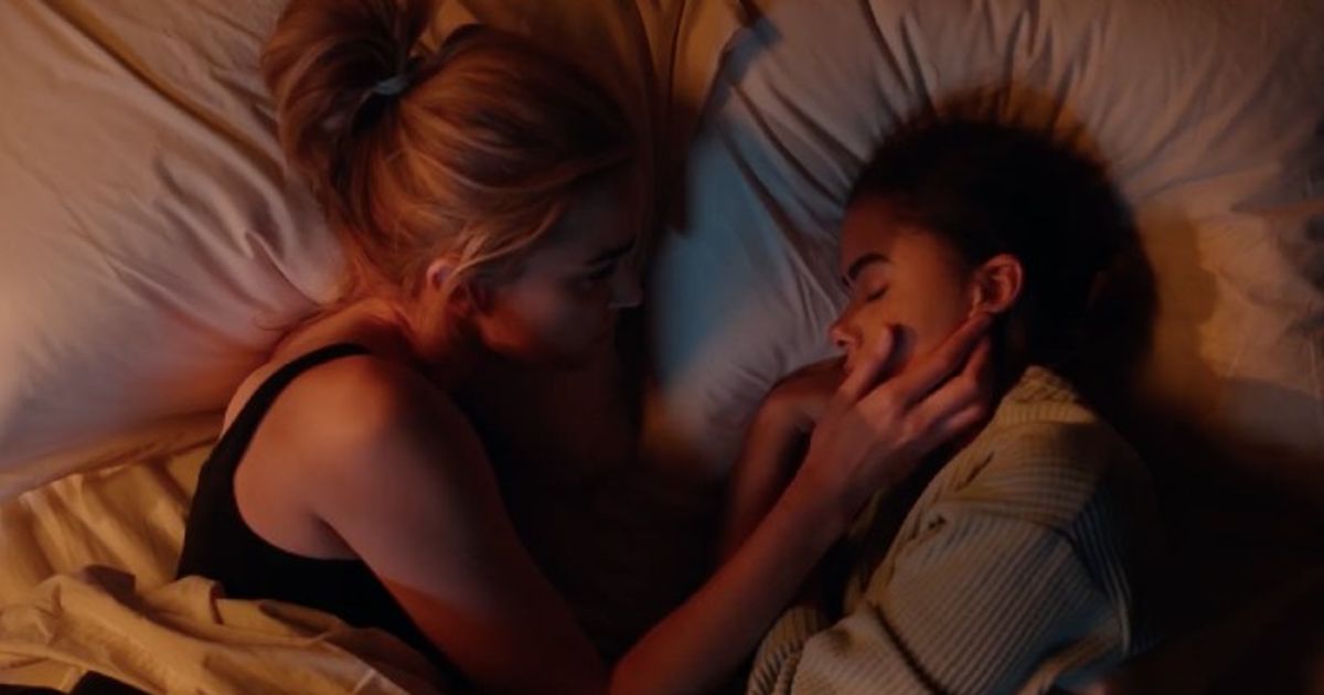 Brianne Howey as Georgia, Antonia Gentry as Ginny in bed in Ginny and Georgia