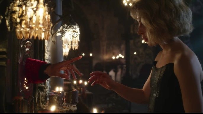 Rafal giving Sophie blood magic through their 'finger glow'