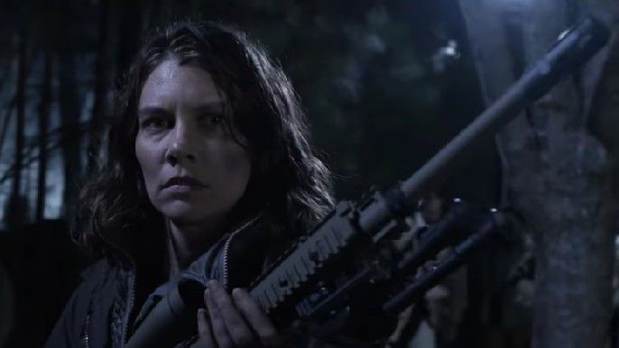 the walking dead Lauren Cohan as Maggie Rhee holding a gun