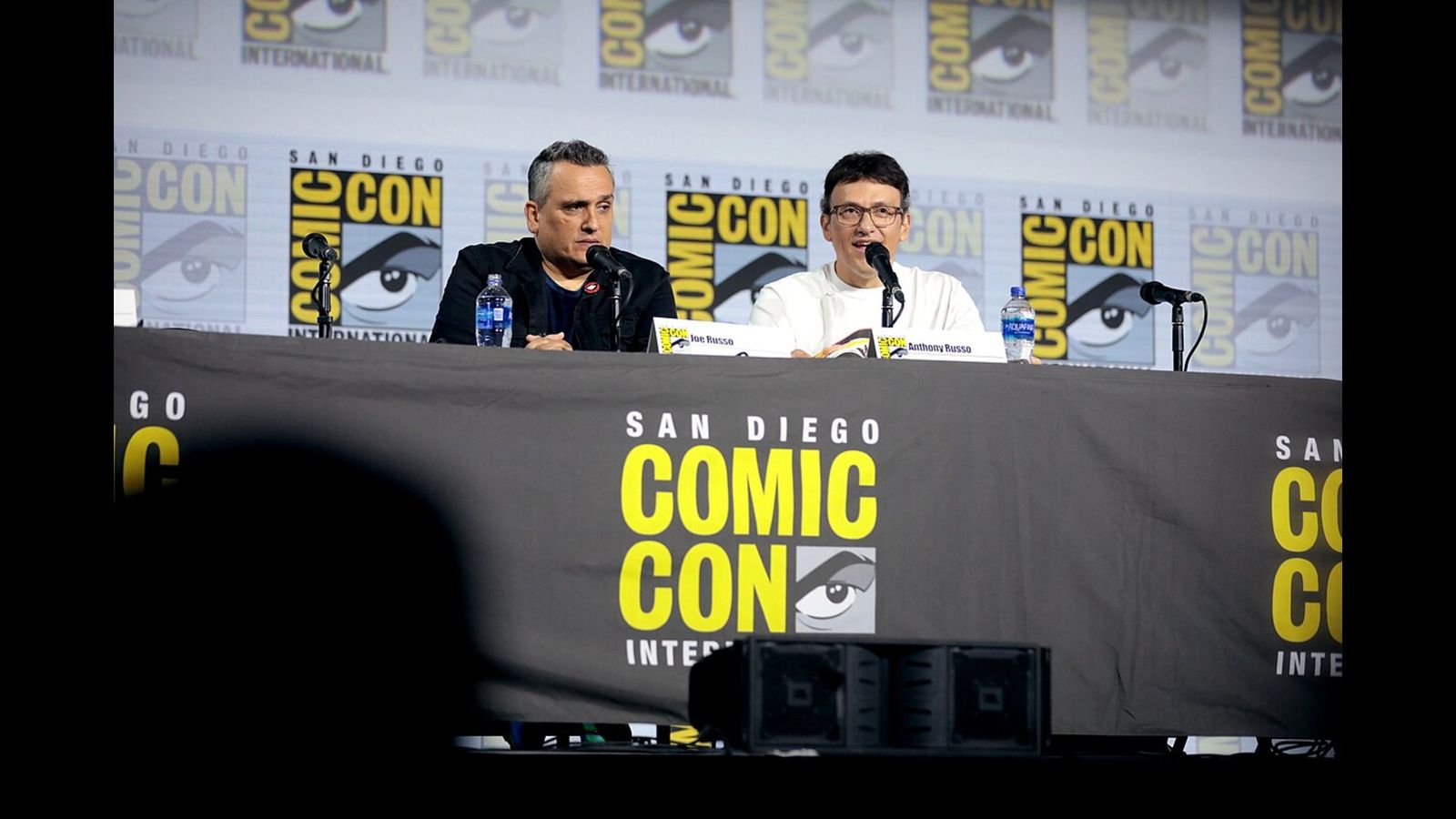Joe Russo and Anthony Russo speaking at the 2019 San Diego Comic Con International, for "A Conversation with the Russo Brothers", at the San Diego Convention Center in San Diego, California.