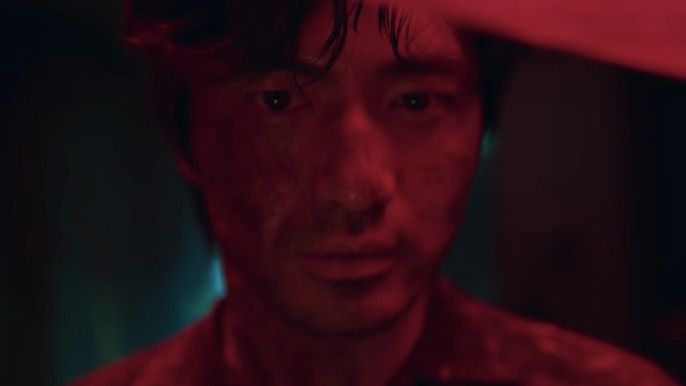 Sweet Home season 1 Lee Jin-wook as Pyeon Sang-wook in a red room staring at camera