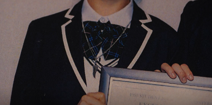 A photo of Kitty's and Yuri's moms wearing the same necklace in the 1993 KISS school yearbook (XO, Kitty Episode 7)