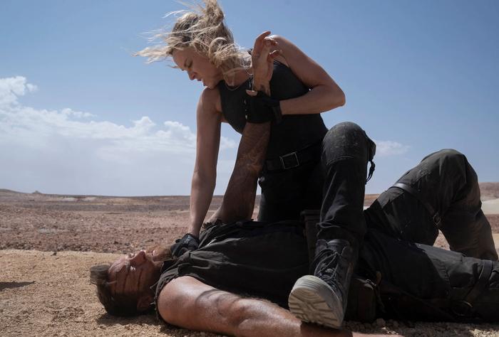 (L-r) JOSH LAWSON as Kano and JESSICA MCNAMEE as Sonya Blade in New Line Cinema’s action adventure “Mortal Kombat,” a Warner Bros. Pictures release. 