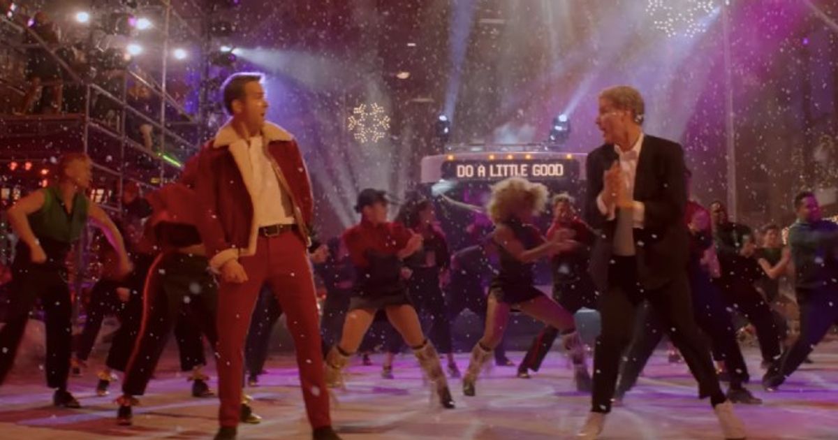 Will Ferrell as the Ghost of Christmas Present, Ryan Reynolds as Clint Briggs in Spirited