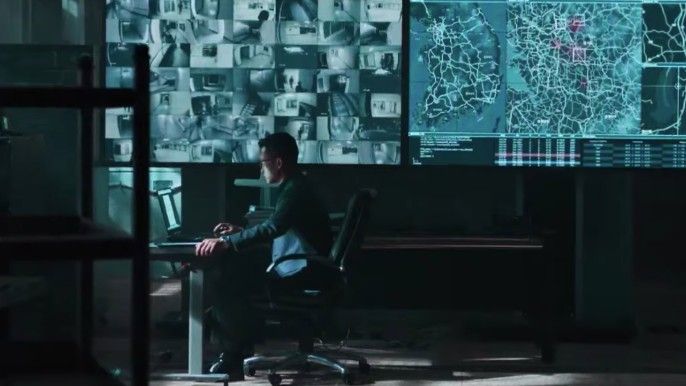 Happiness Jo Woo-jin as Han Tae-seok sits on office chair watching CCTV